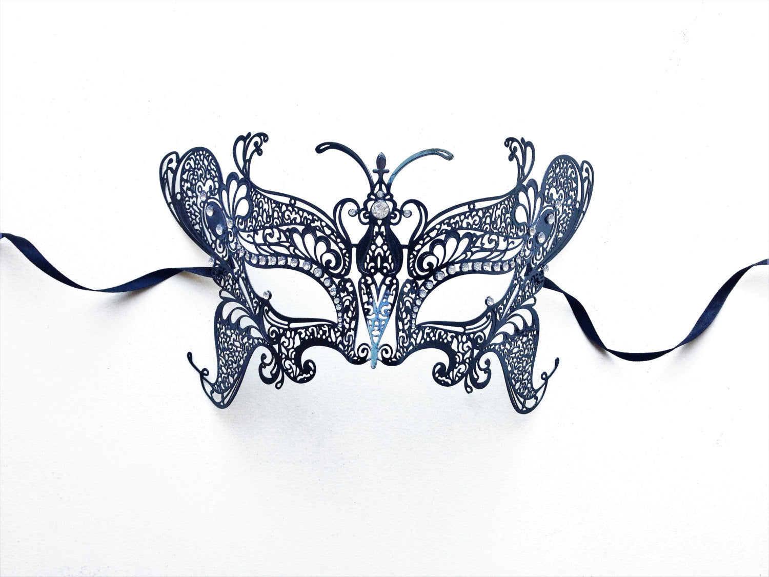 Elegant black filigree butterfly mask with satin ribbon ties for costume events