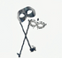 Black phantom-style men’s masquerade mask on stick with matching women’s rhinestone filigree mask, designed for elegant couple’s wear.