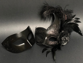 Elegant black couples masquerade mask set with feathered women’s mask and men’s classic mask