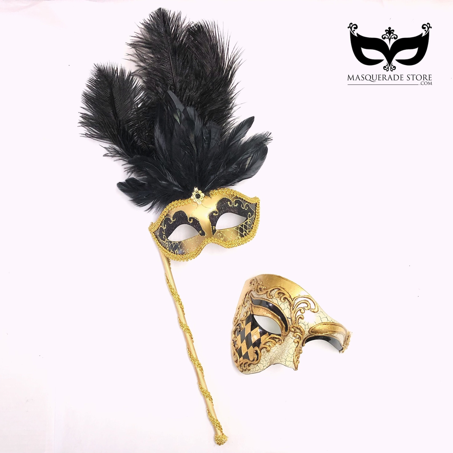 Black and gold masquerade couple’s mask set with a feathered women’s stick mask and a men’s harlequin scroll mask.