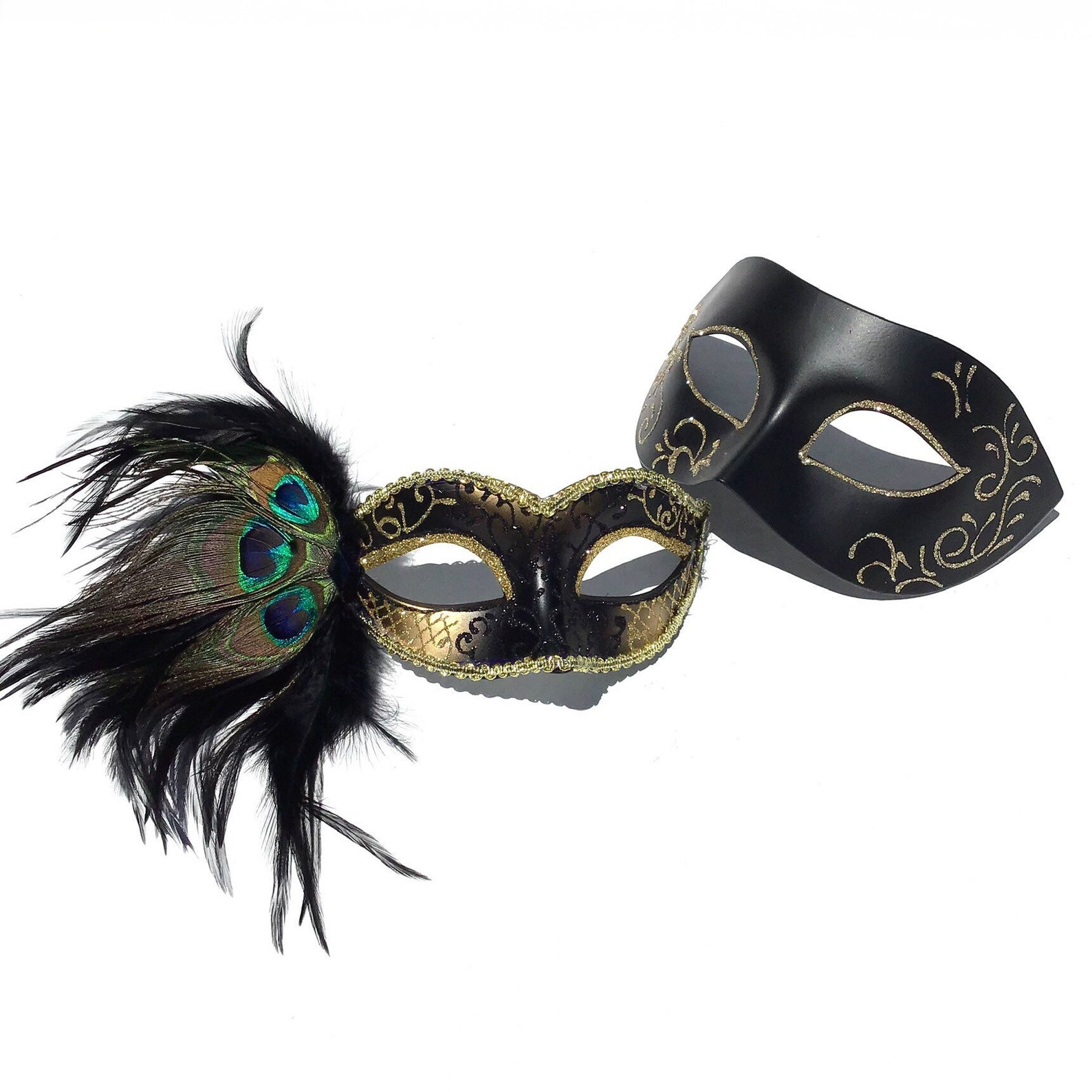 Couple’s masquerade mask set with a black and gold peacock feather women’s mask and a men’s matte black mask with gold scrolls.
