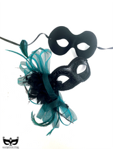 Elegant black masquerade mask duo with green feather accents, perfect for prom or themed events.