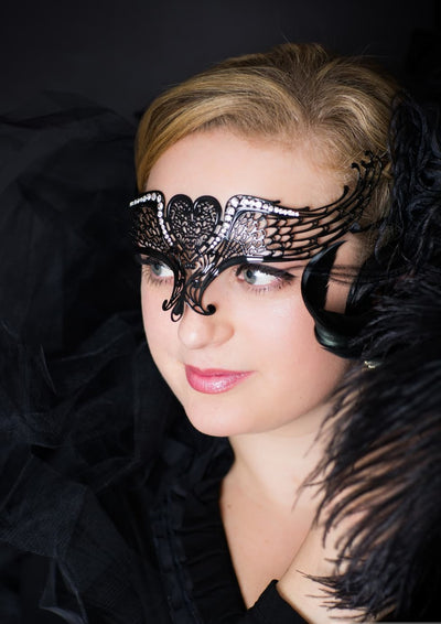 Gothic angel wing masquerade mask in elegant black lace for Halloween or costume events