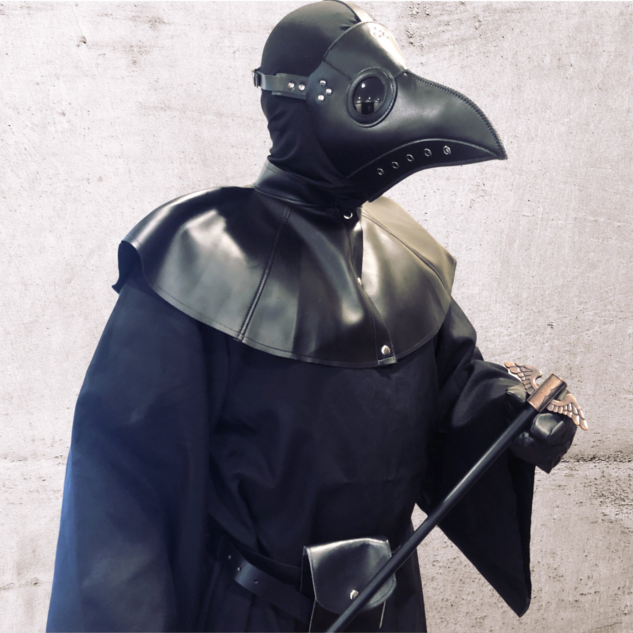 Gothic black masquerade costume with beaked plague doctor mask