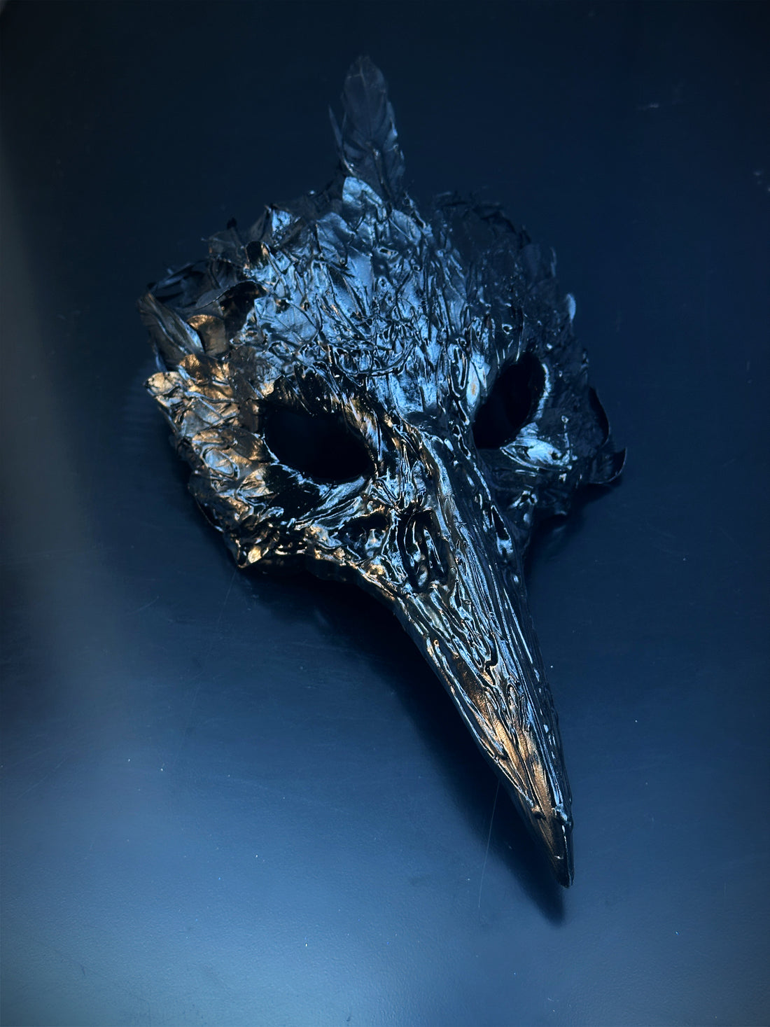 Glossy black plague doctor mask with long beak for Halloween, Venetian masquerade, or gothic cosplay.