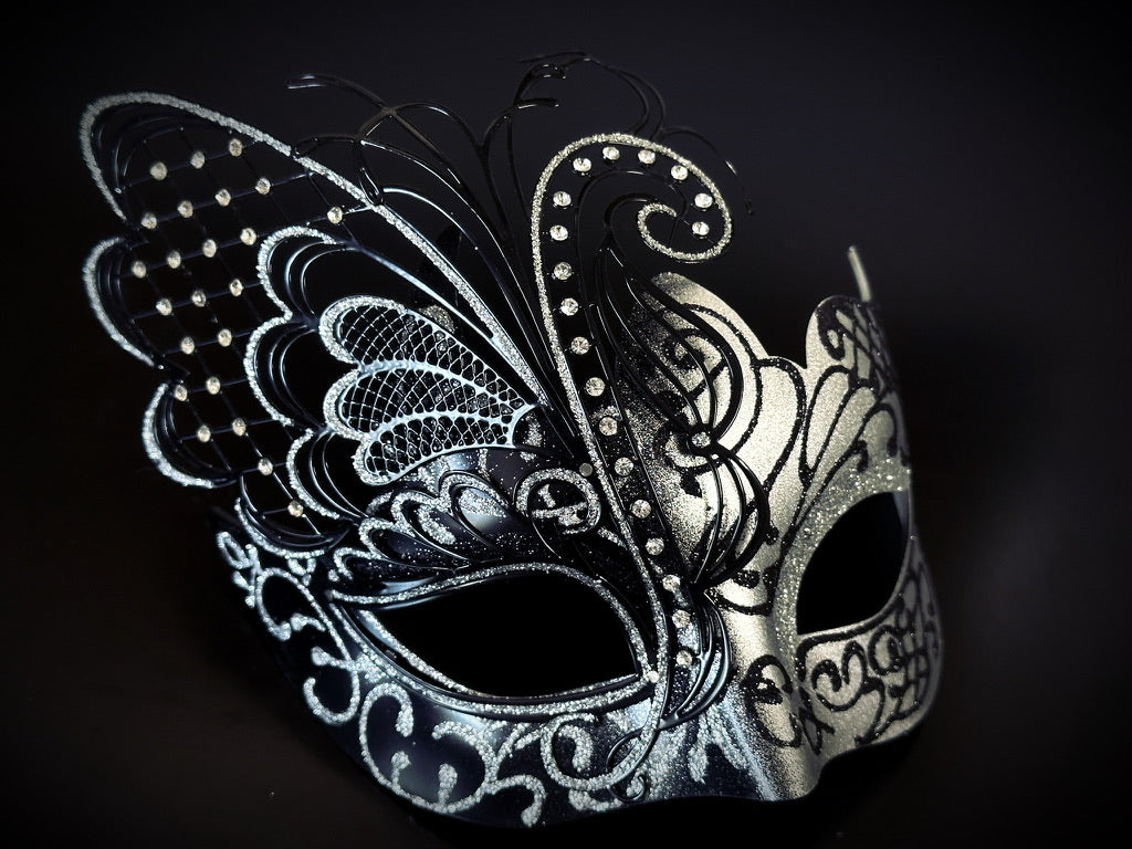 Elegant masquerade mask in butterfly shape with silver and black detailing, ideal for fantasy balls