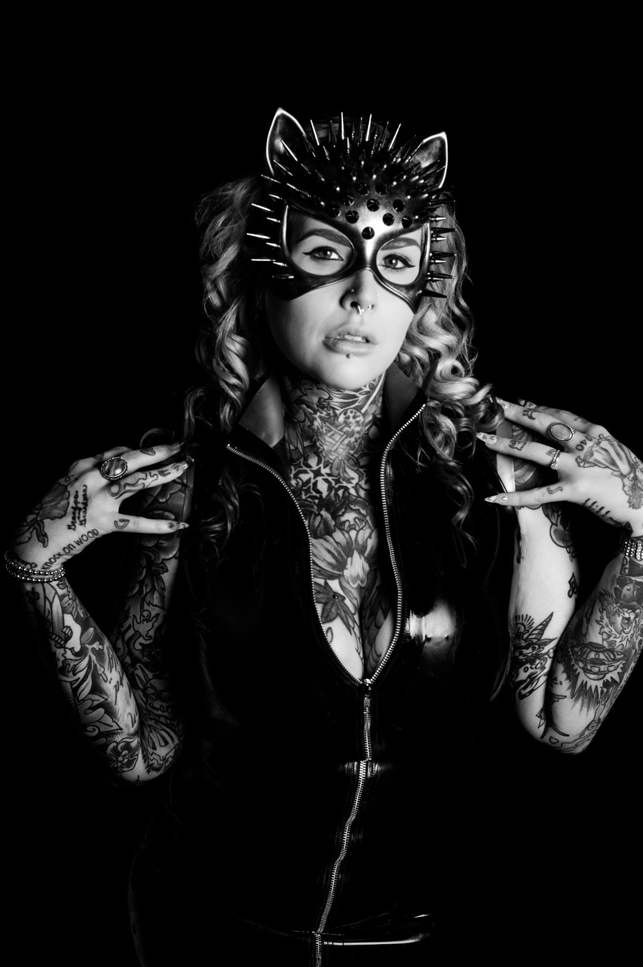 Black cat masquerade mask with ears and spikes styled for bold costume look