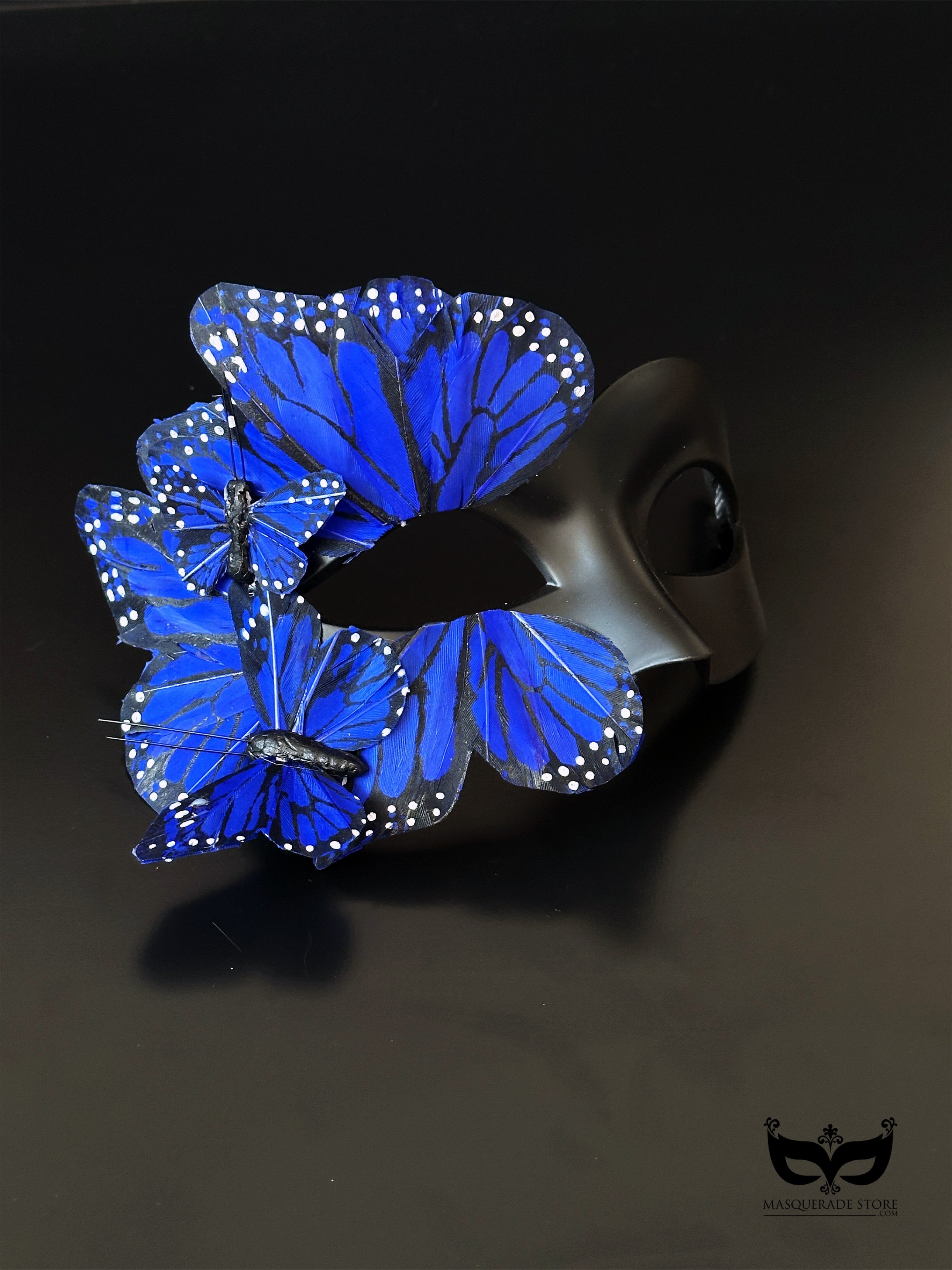 Blue butterfly masquerade mask with layered wings for masquerade events.