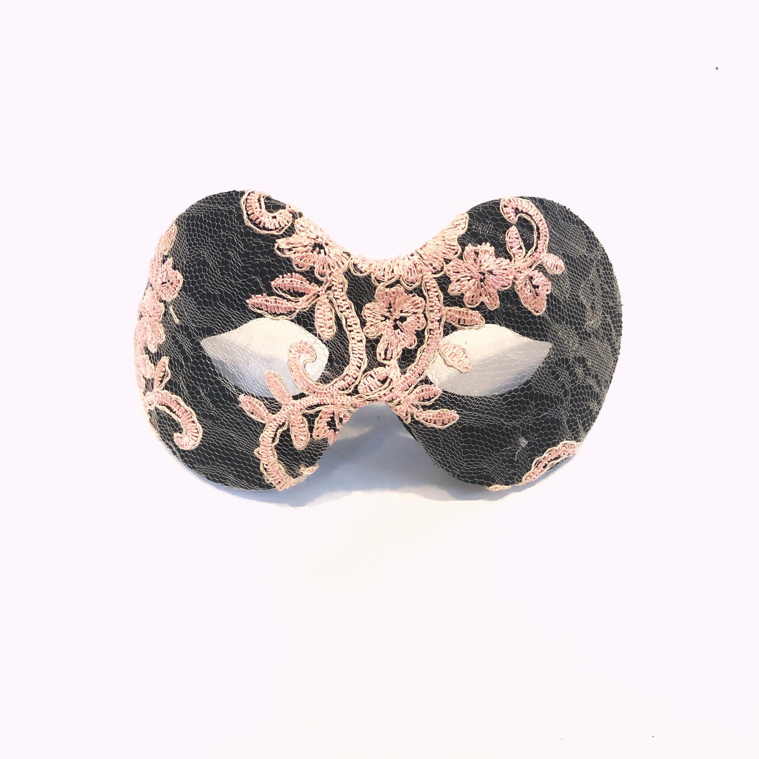 Black masquerade mask with blush pink lace embroidery and floral design.