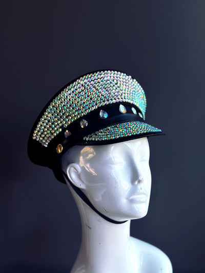 Captain's hat covered in iridescent rhinestones on a black base.