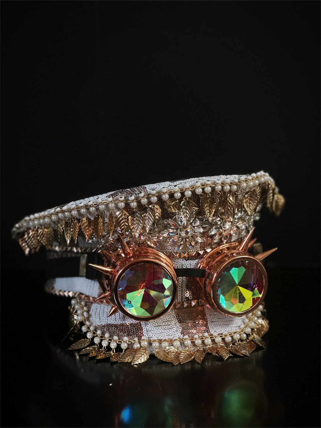 Captain hat in rose gold and white with spiked rose gold goggles.