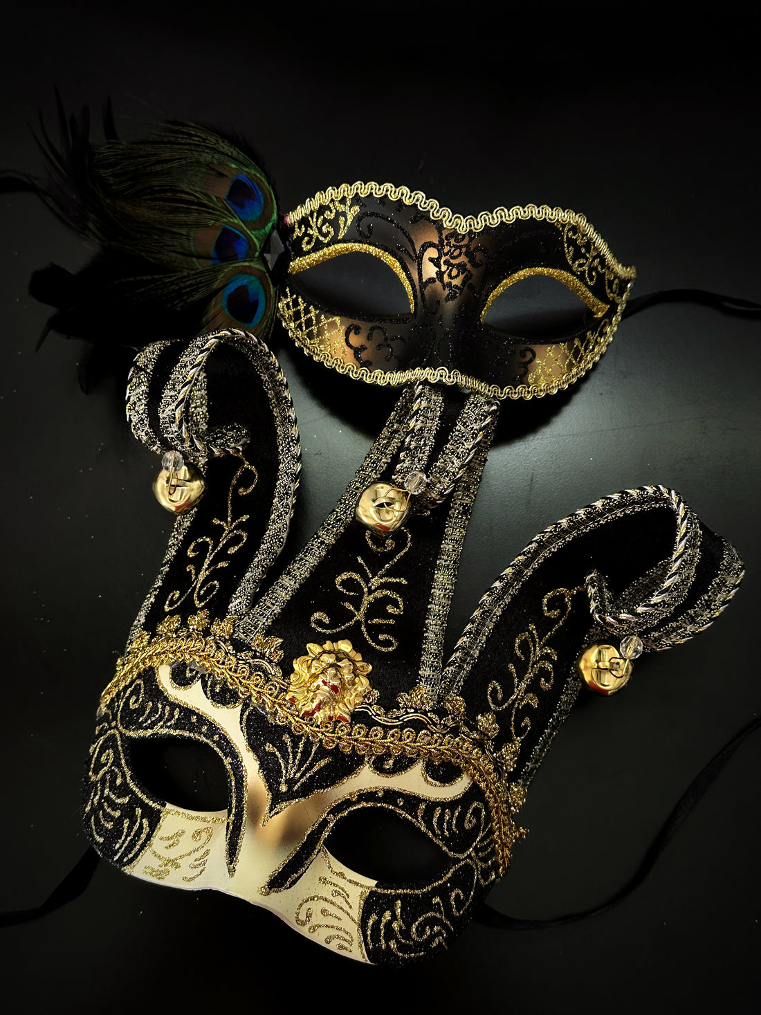 Black and gold couples masquerade mask set with Venetian jester mask and peacock feather mask, ideal for prom, Halloween, or masquerade ball.