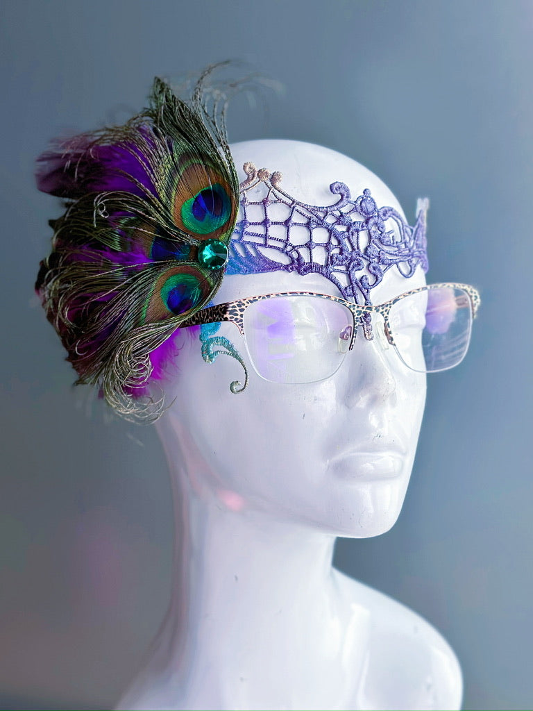 Eyeglass-compatible masquerade mask with purple lace and peacock feather accents for Halloween or prom