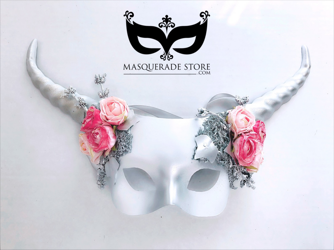 Silver horn masquerade mask with pink roses and frosted accents for fantasy weddings.