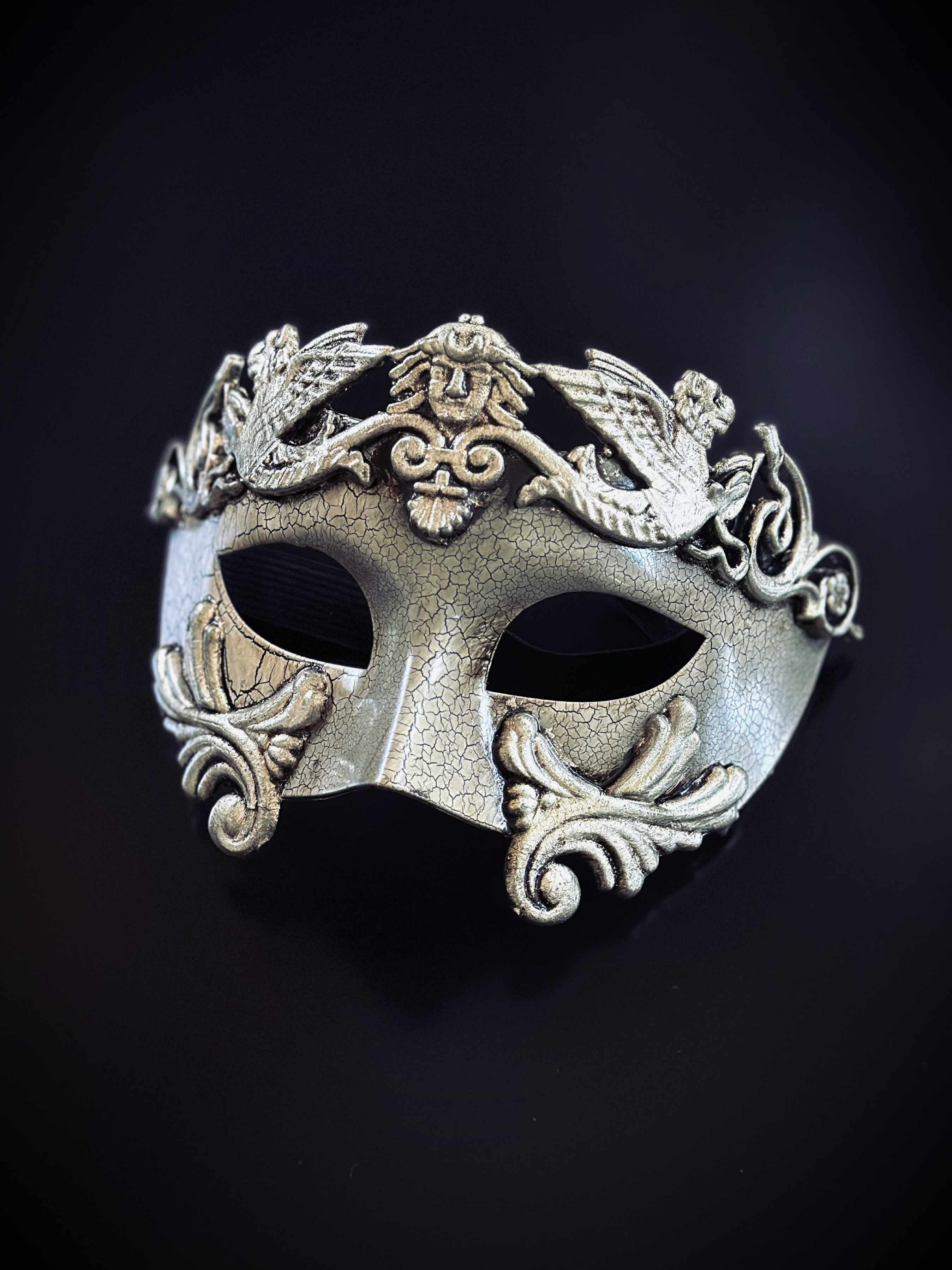Silver gladiator-style masquerade mask with classical detailing and armor-inspired accents for prom or masquerade events.