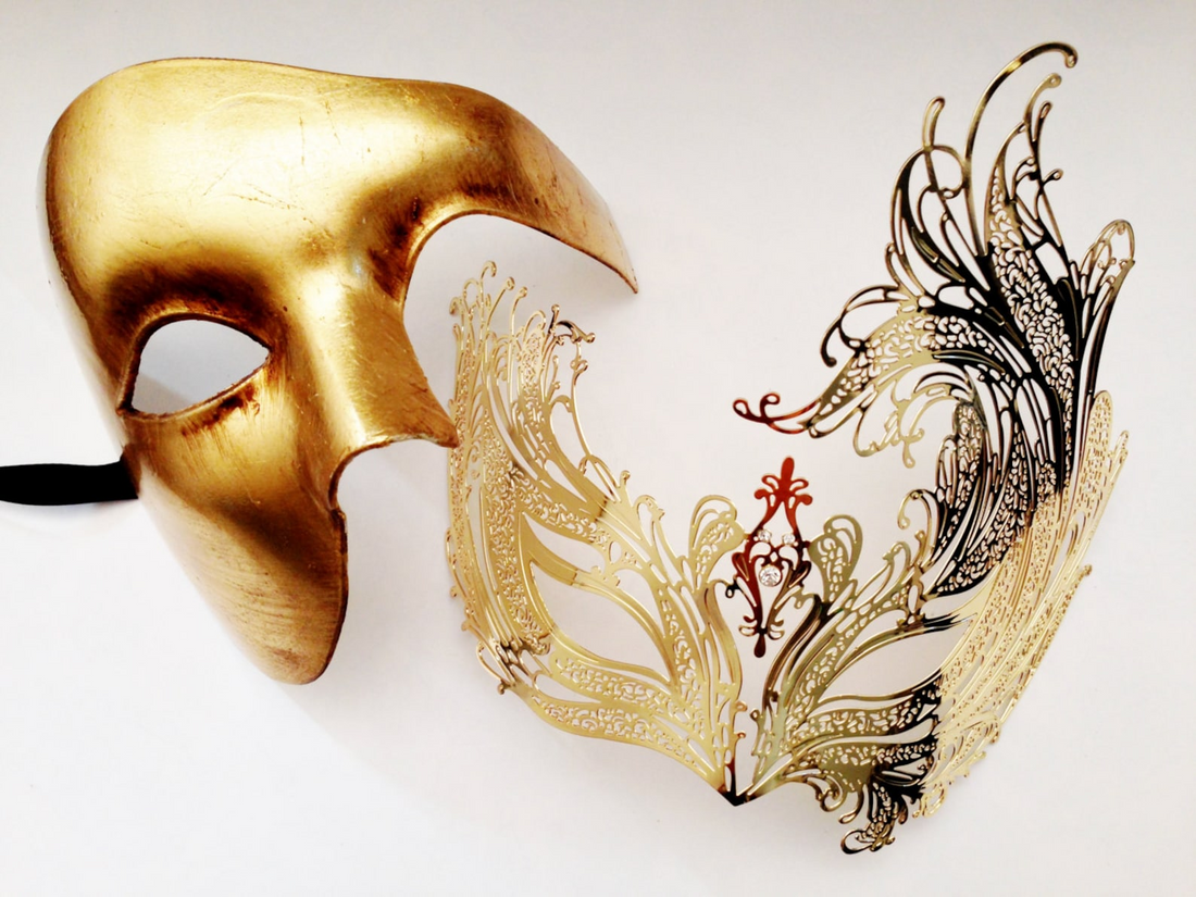 Gold couples masquerade mask set featuring a bold metallic Venetian men’s mask and intricate gold filigree women’s mask.