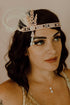 Vintage-style Gatsby headband in rose gold with crystal and feather accents for bridal or themed parties