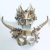 Elegant gold masquerade masks with twisted horns and floral designs for prom, parties, or masquerade events.