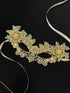 Elegant gold lace masquerade mask with pearl accents and floral design, ideal for proms, weddings, and masquerade balls.