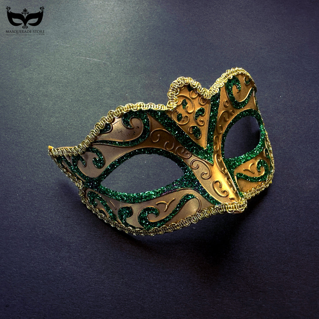 Green and gold masquerade mask with glitter scroll details for Mardi Gras and elegant costume parties