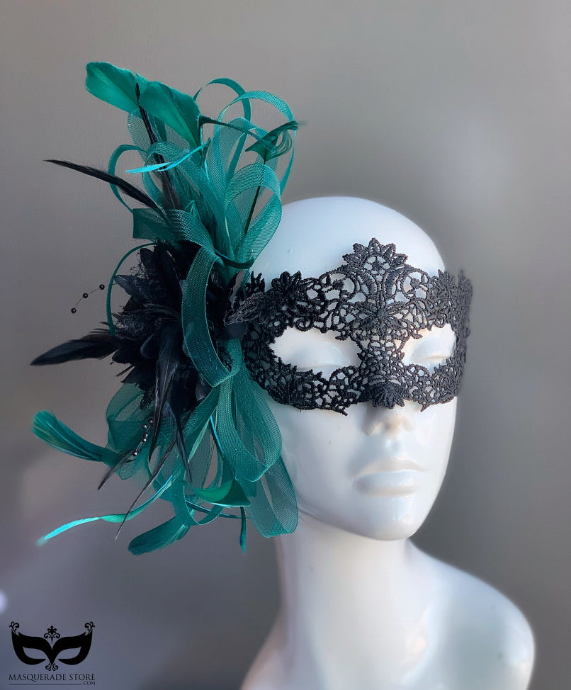 Elegant green teal feather masquerade mask with black lace and ribbon for Mardi Gras or fantasy balls.