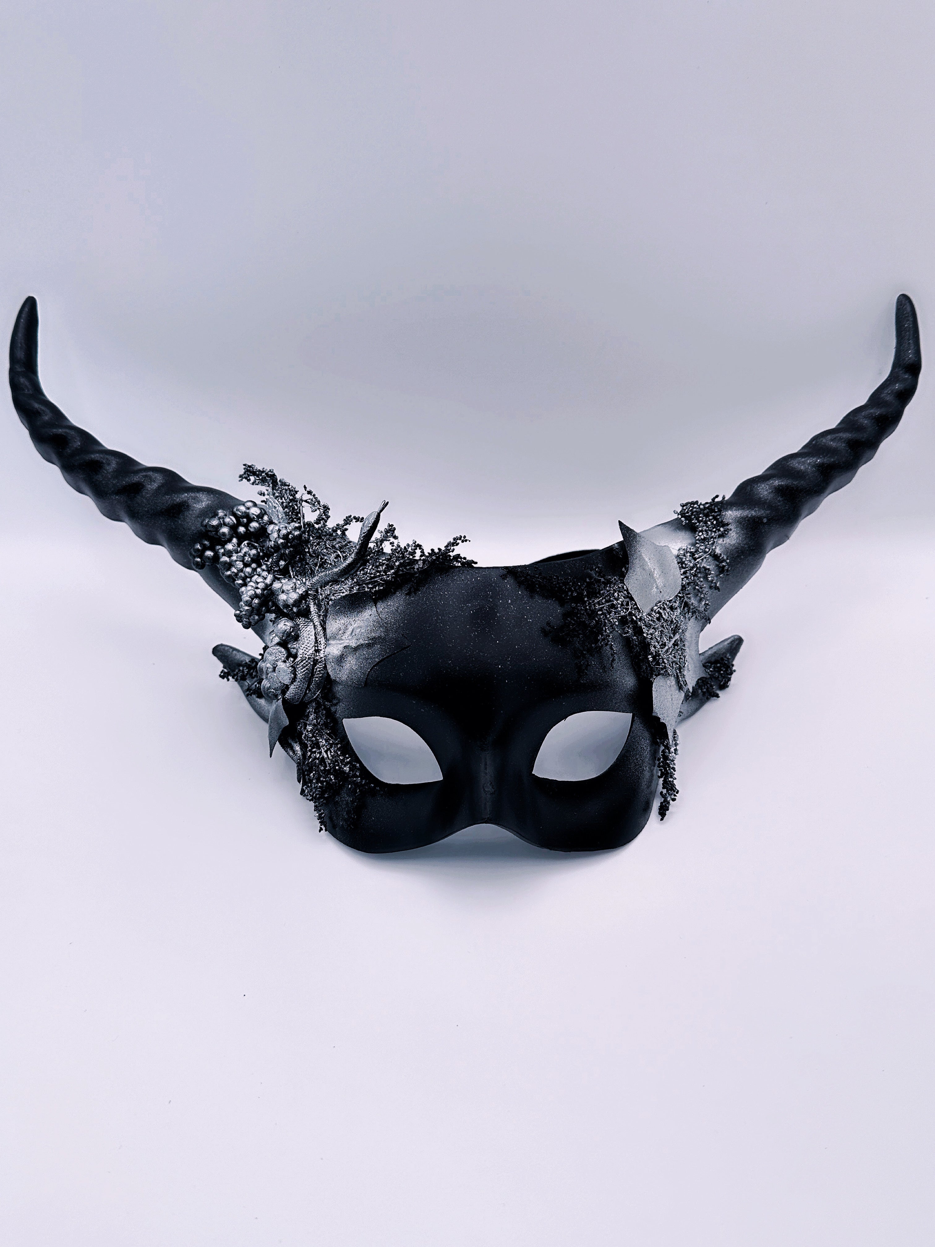 Dragon-themed black masquerade mask with silver metallic accents and sculpted horns