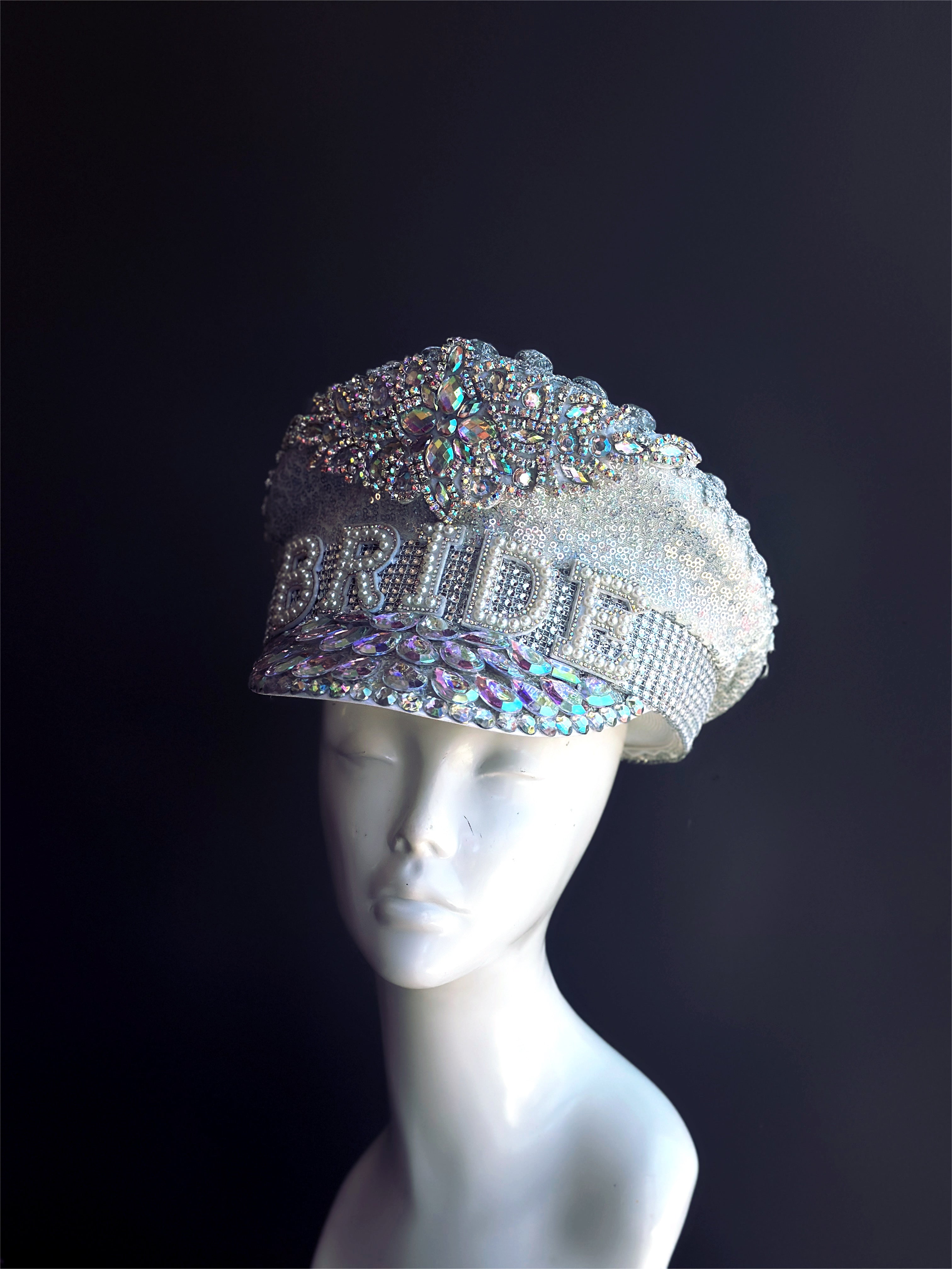 captains hat with silver sequins, iridescent crystals, and pearls with "bride" on the front.