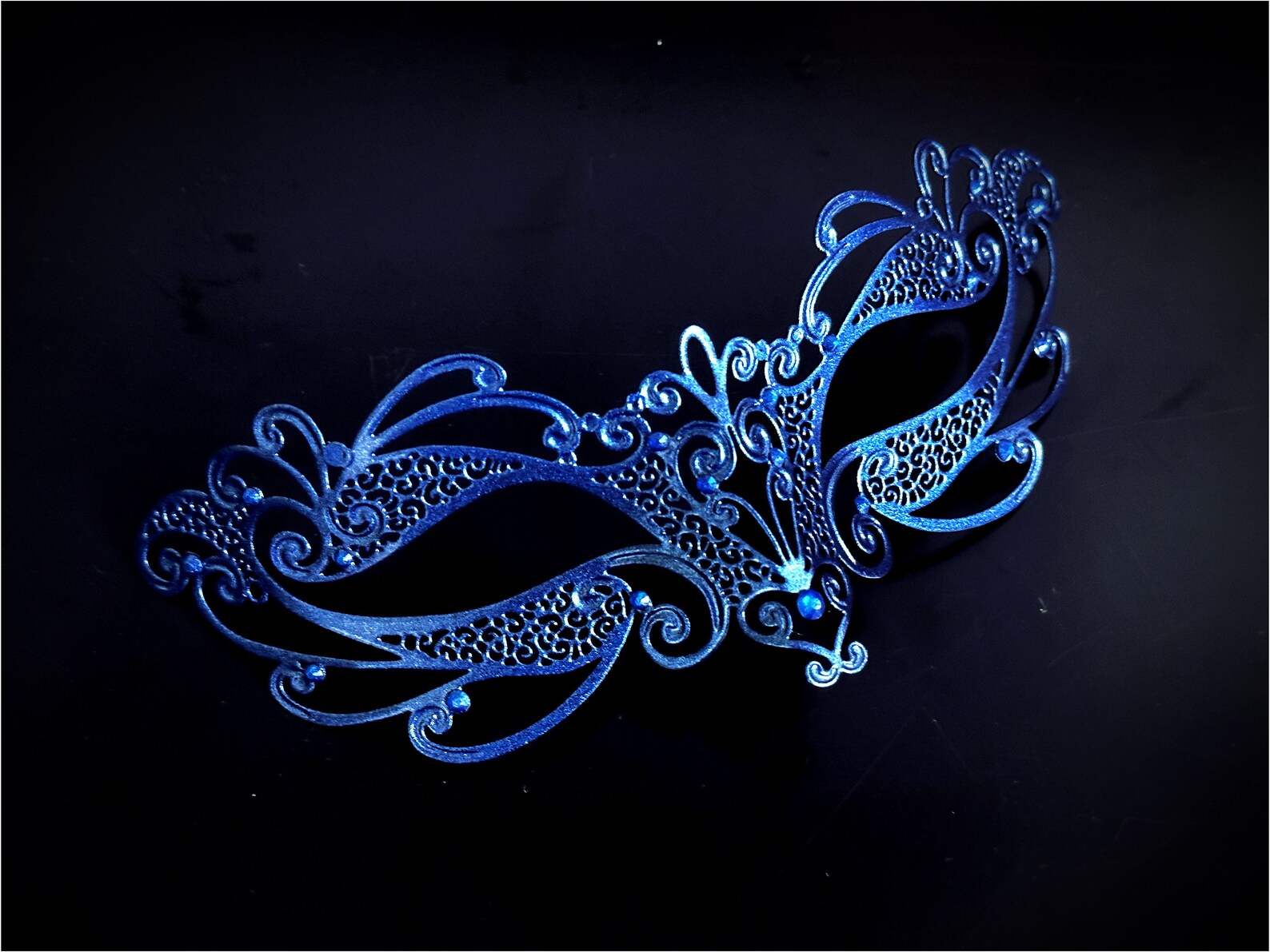 Kids masquerade mask in blue laser cut metal.