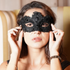 Elegant black lace mask for women with bead details, held over face