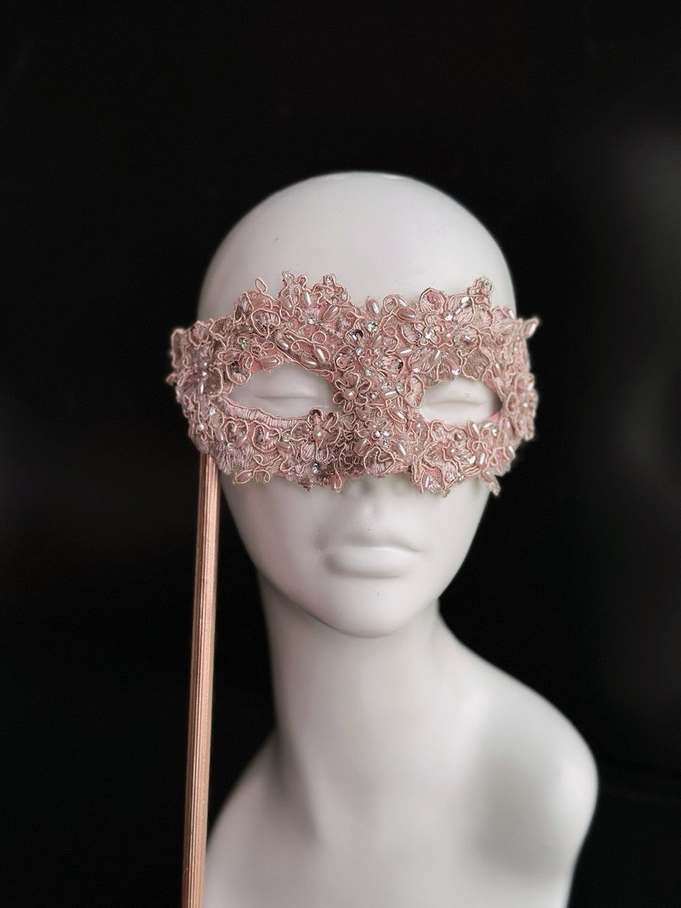 Light pink lace masquerade mask with rhinestones for party and wedding events.