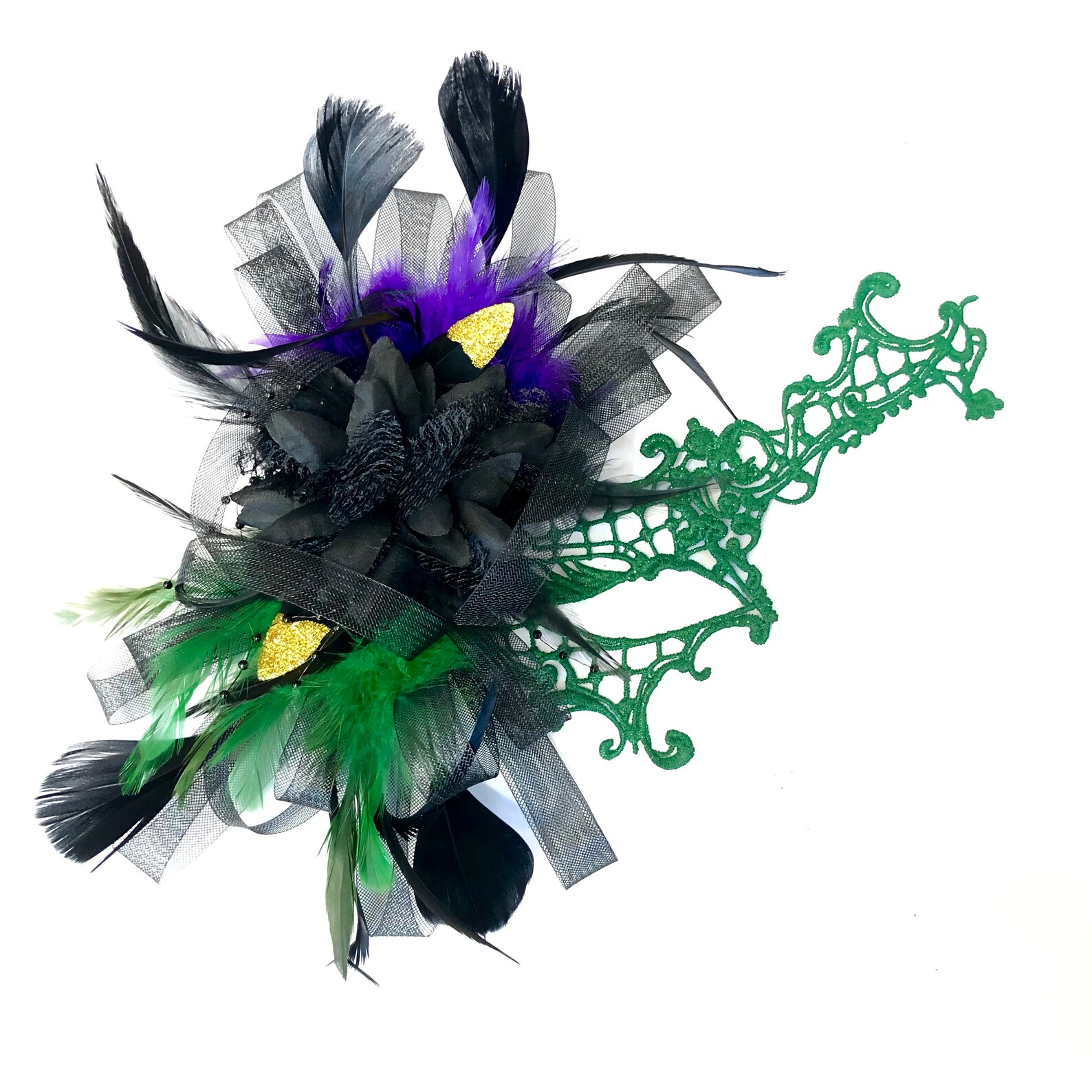 Mardi Gras masquerade mask with green lace mask adorned with black and green feathers.