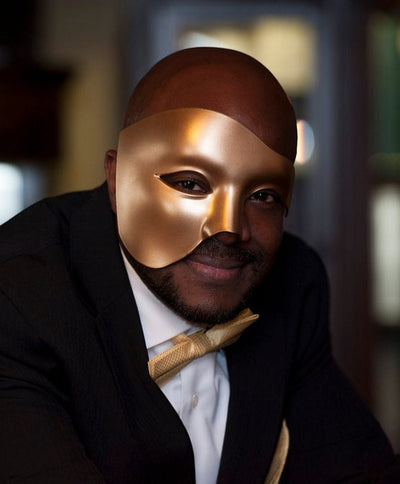 Men's masquerade mask half face Phantom of the Opera style in gold.