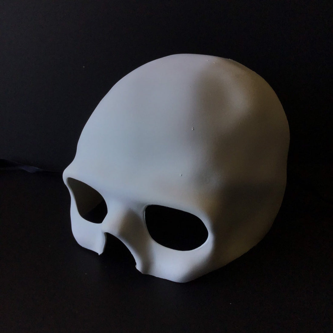 Blank white skull masquerade mask for DIY projects.