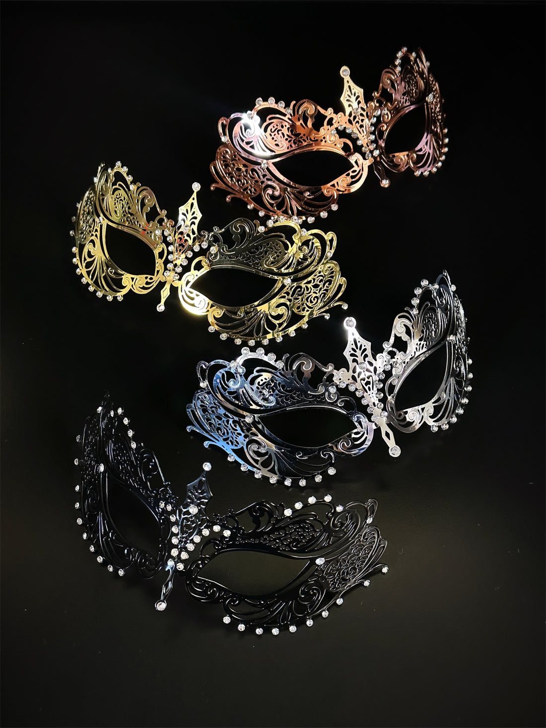 Collection of metal masquerade masks in silver, gold, black, and rose gold—perfect for formal events or prom.