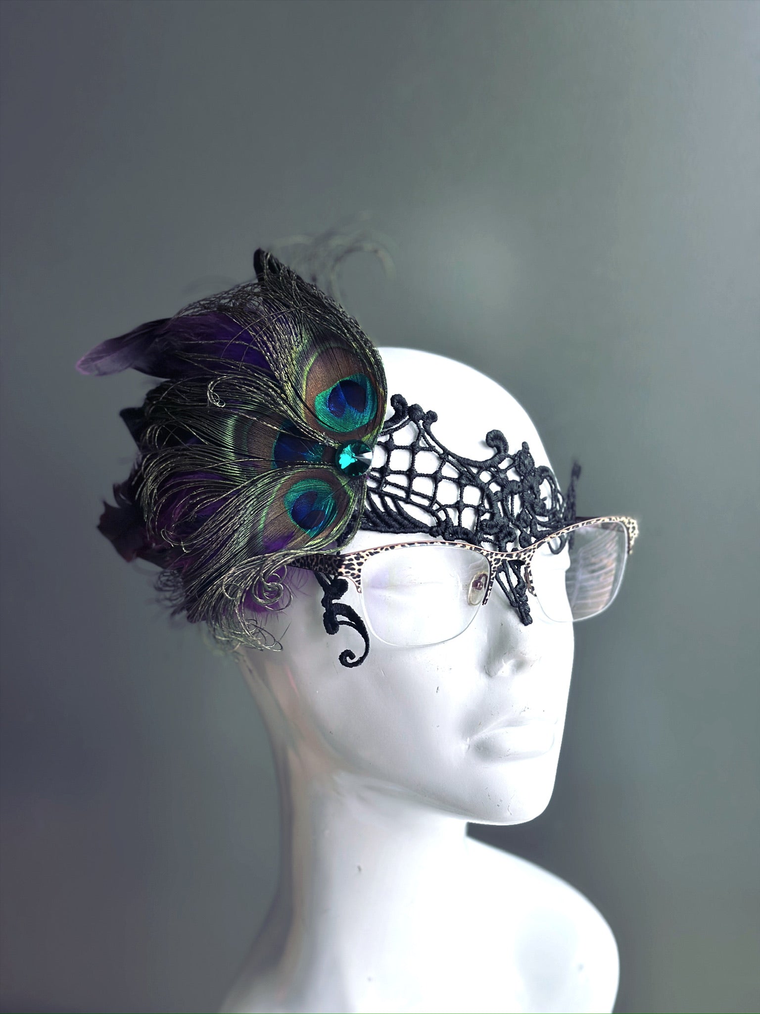 Elegant peacock feather masquerade mask that fits over glasses