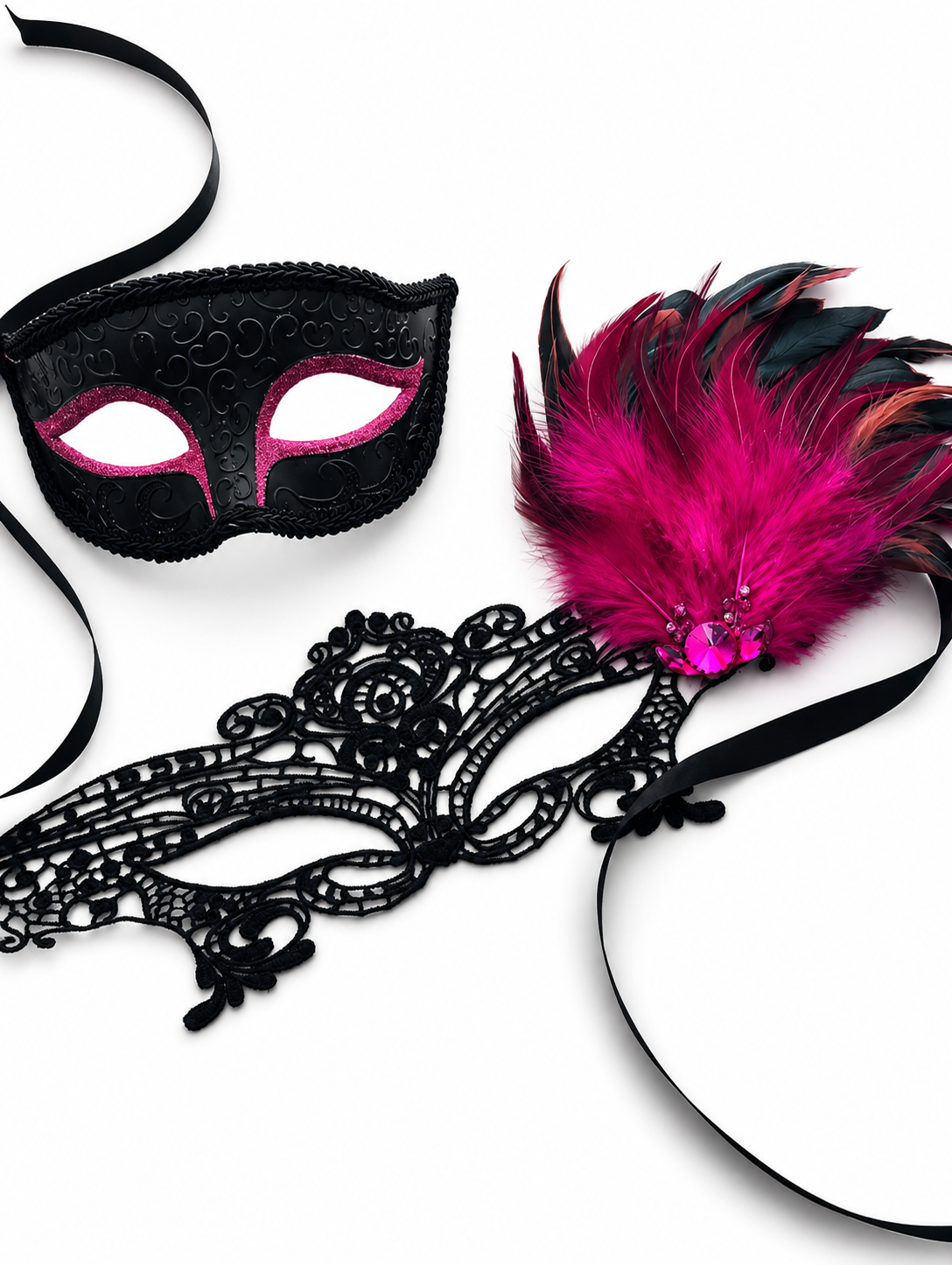 Black and pink masquerade masks with feathers on a white background