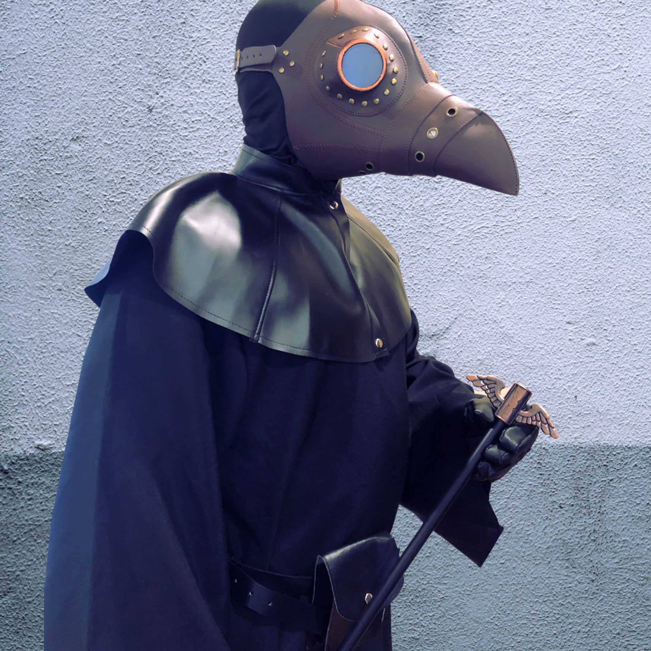 Full masquerade outfit with plague doctor mask, goggles, and black cape.