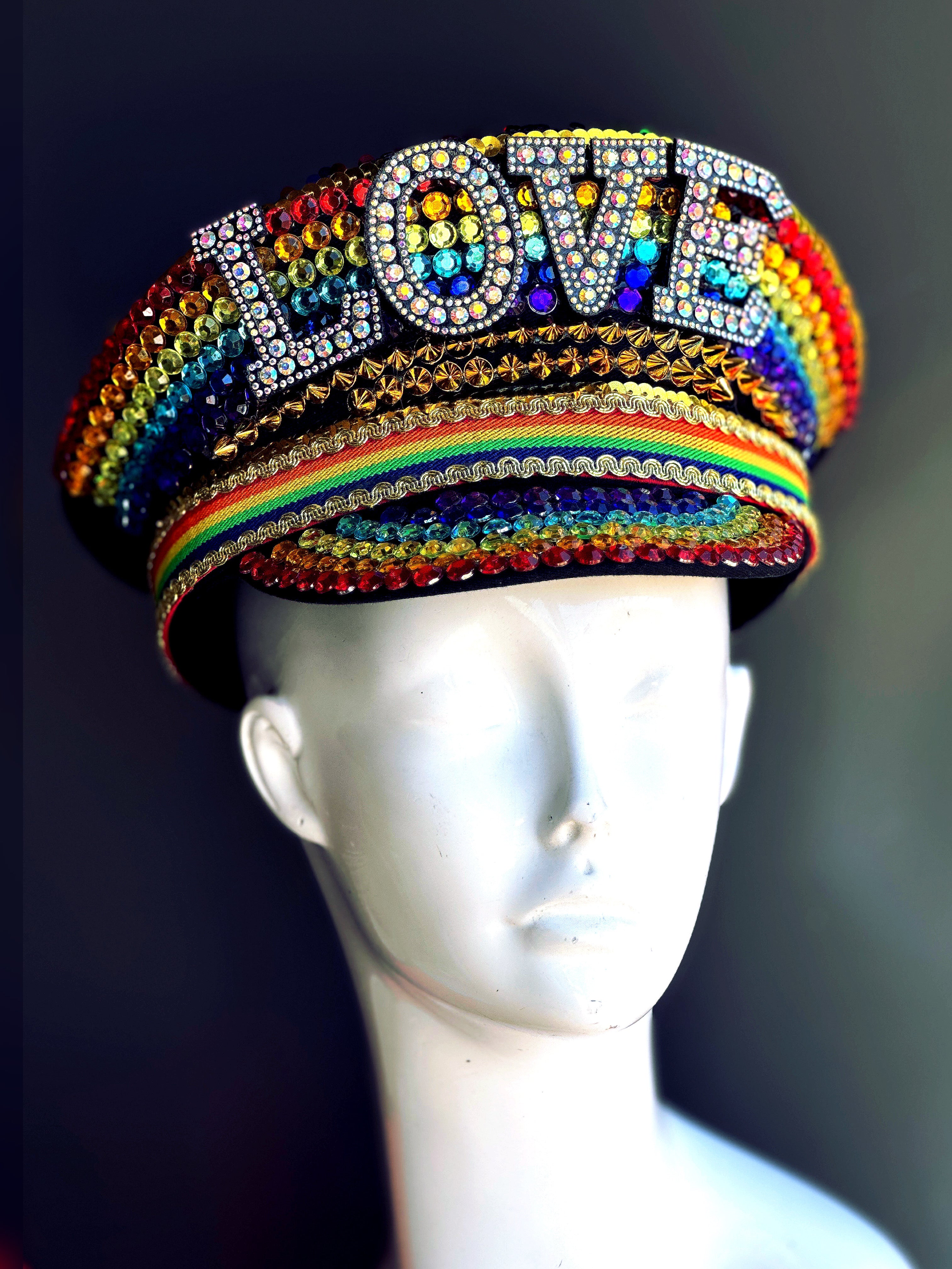 Rainbow rhinestone captain hat with LOVE statement letters, designed for Pride, drag, and festival costumes
