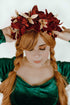 Masquerade holiday headpiece with red velvet poinsettias and gold floral accents