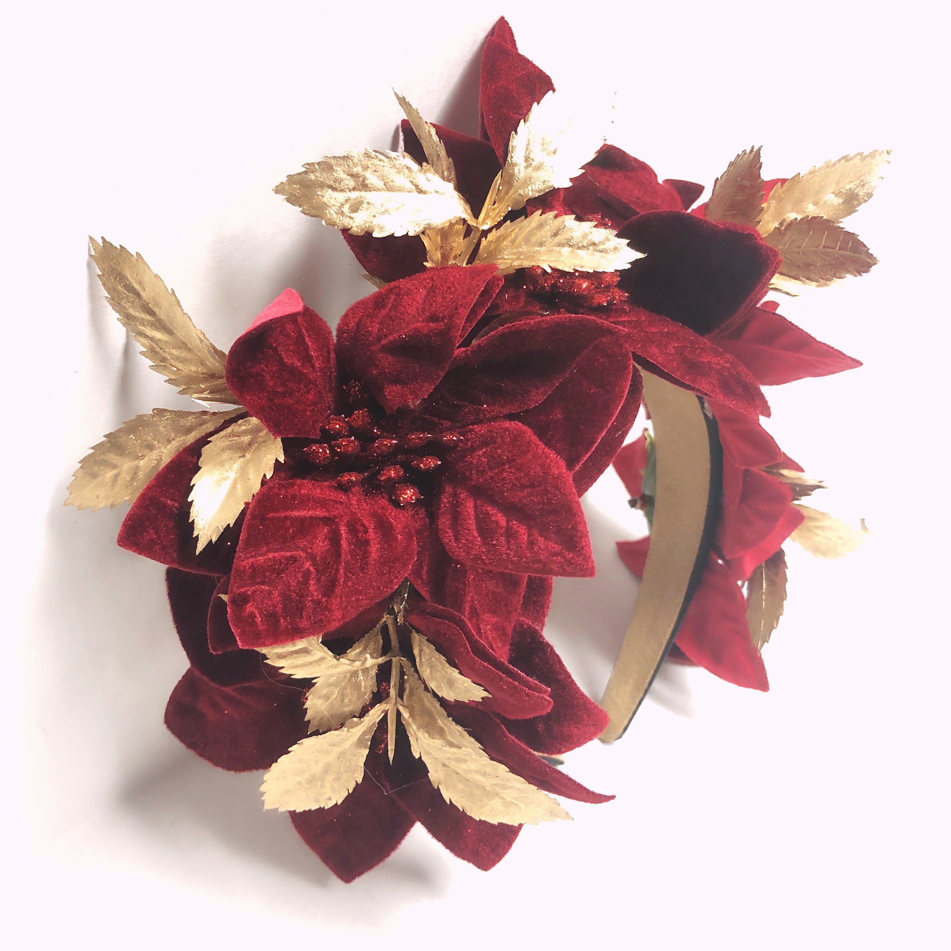 Red poinsettia Christmas headband with gold leaves, festive floral holiday hair accessory for parties, festivals, and winter celebrations.