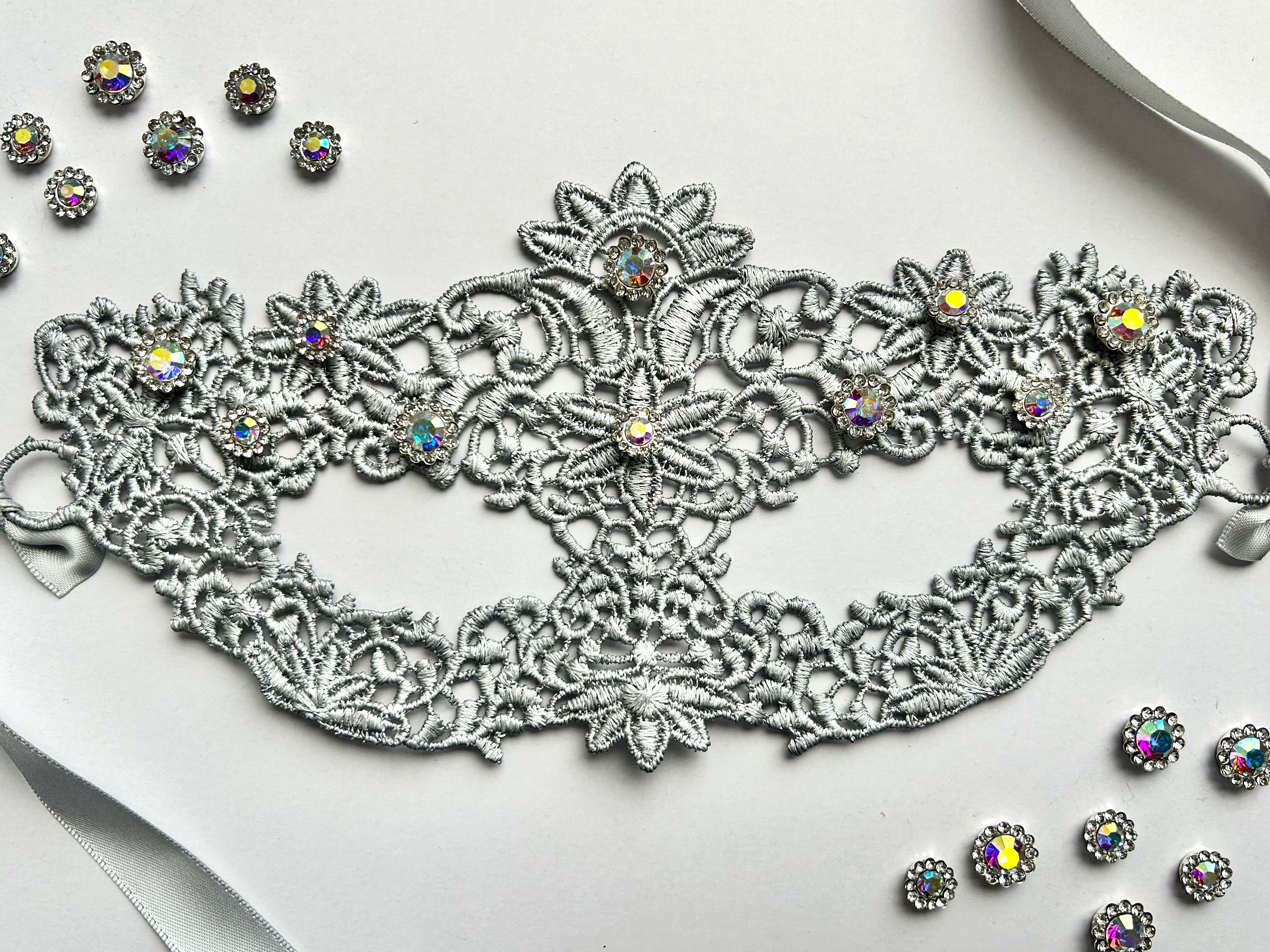 Silver floral lace masquerade mask with aurora rhinestones for moon ball and Venetian gala events.