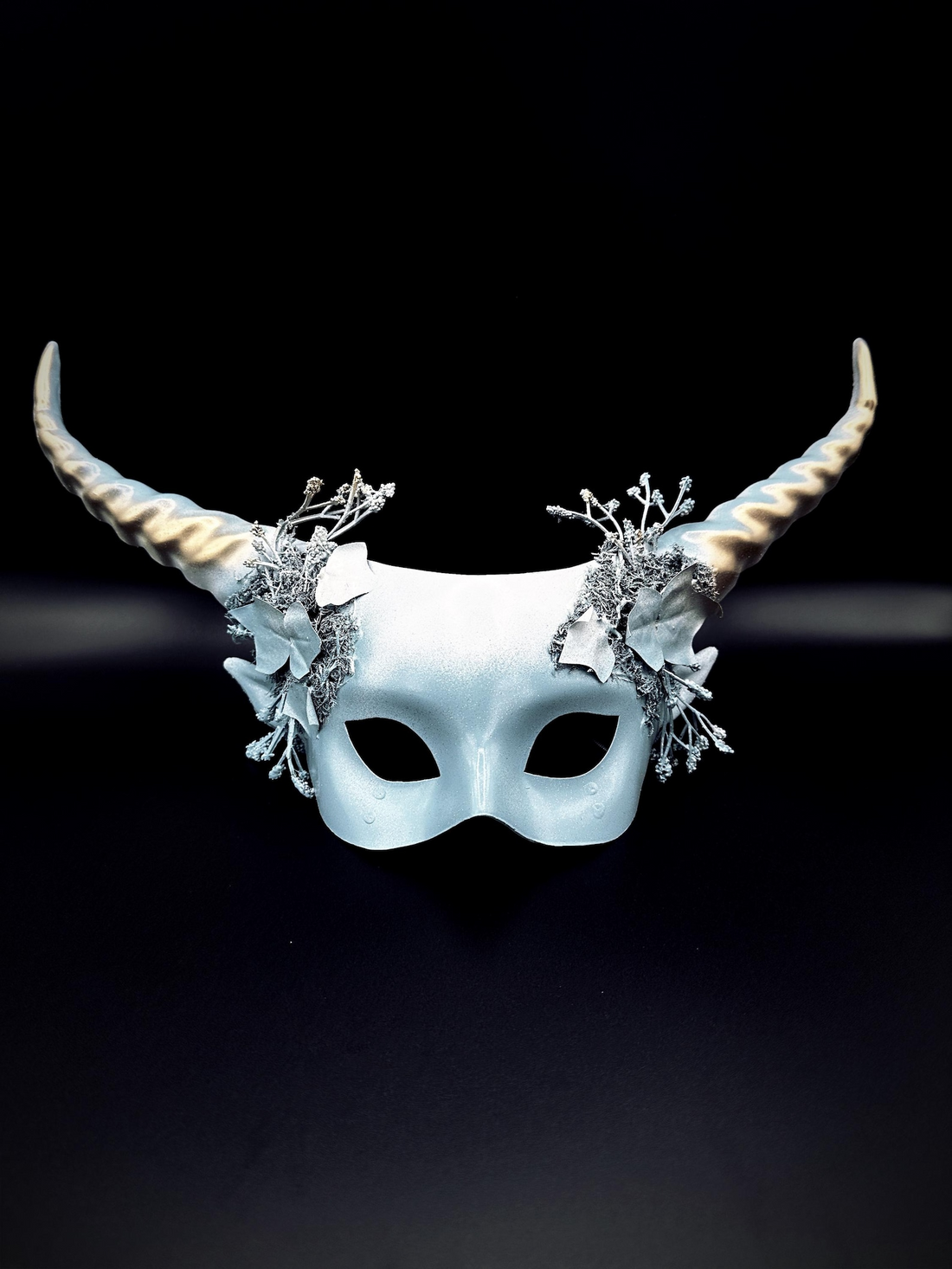 Silver horn masquerade mask with frosted floral details and fantasy headdress design