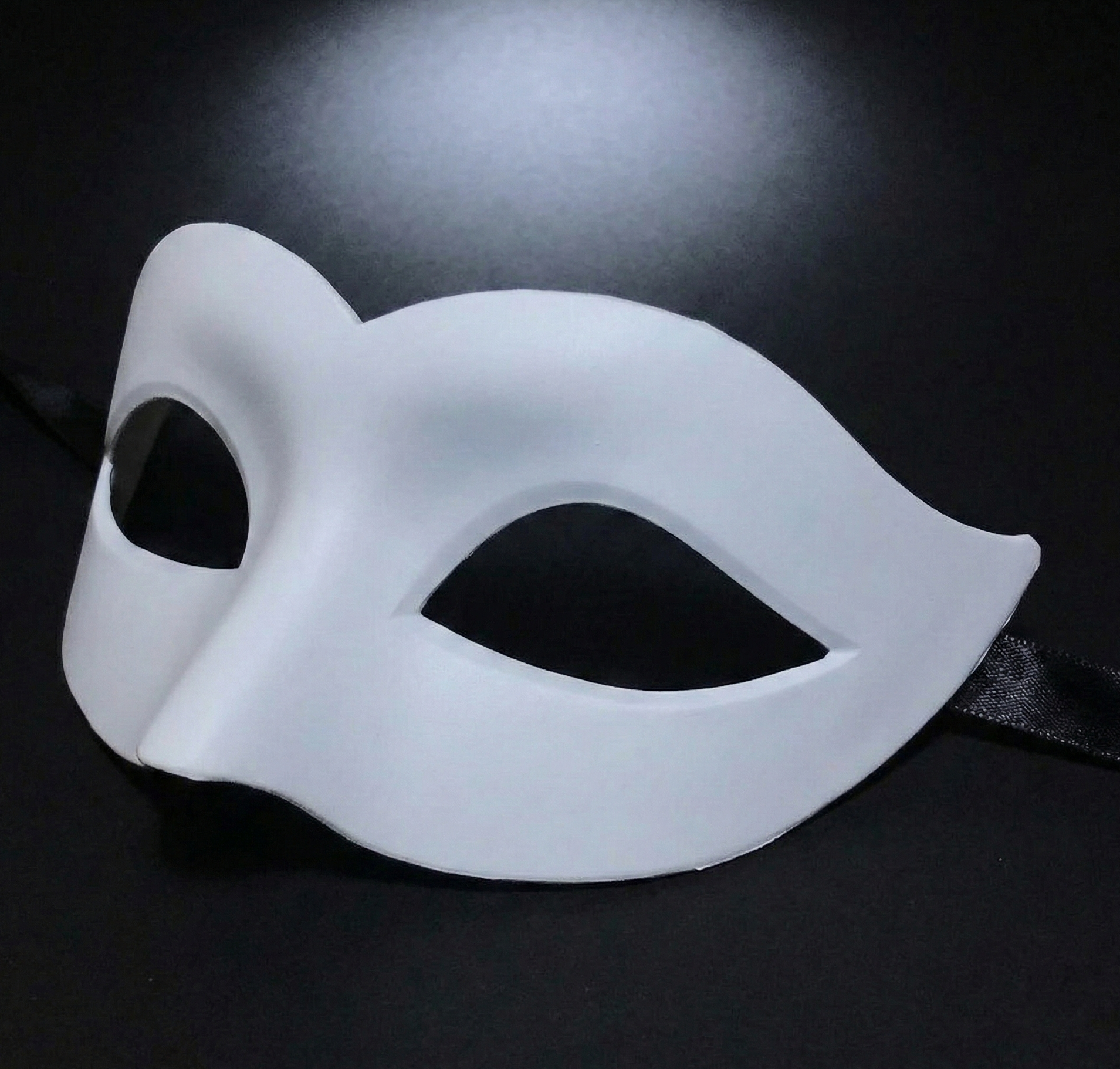 White mask on a black background