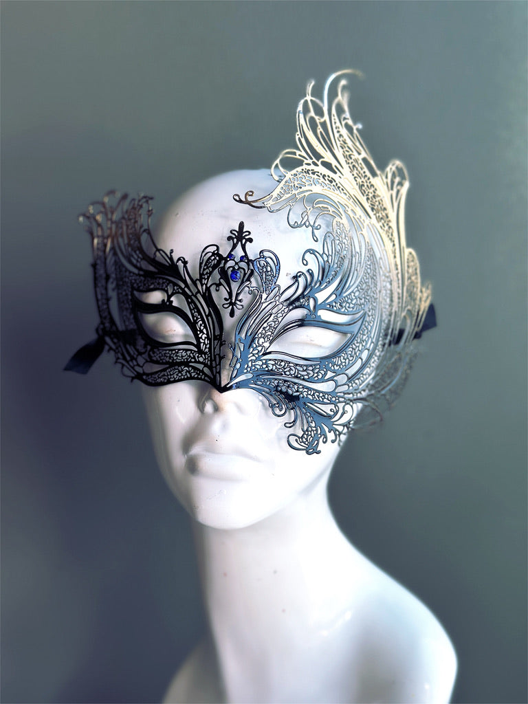 Elegant swan-inspired masquerade mask featuring black and gold metal filigree