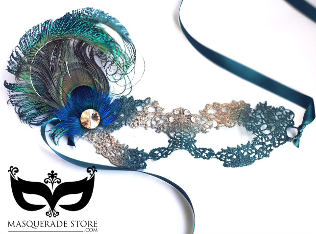 Elegant teal peacock feather mask with lace base, satin ribbon ties, and floral gold embellishment for masquerade events