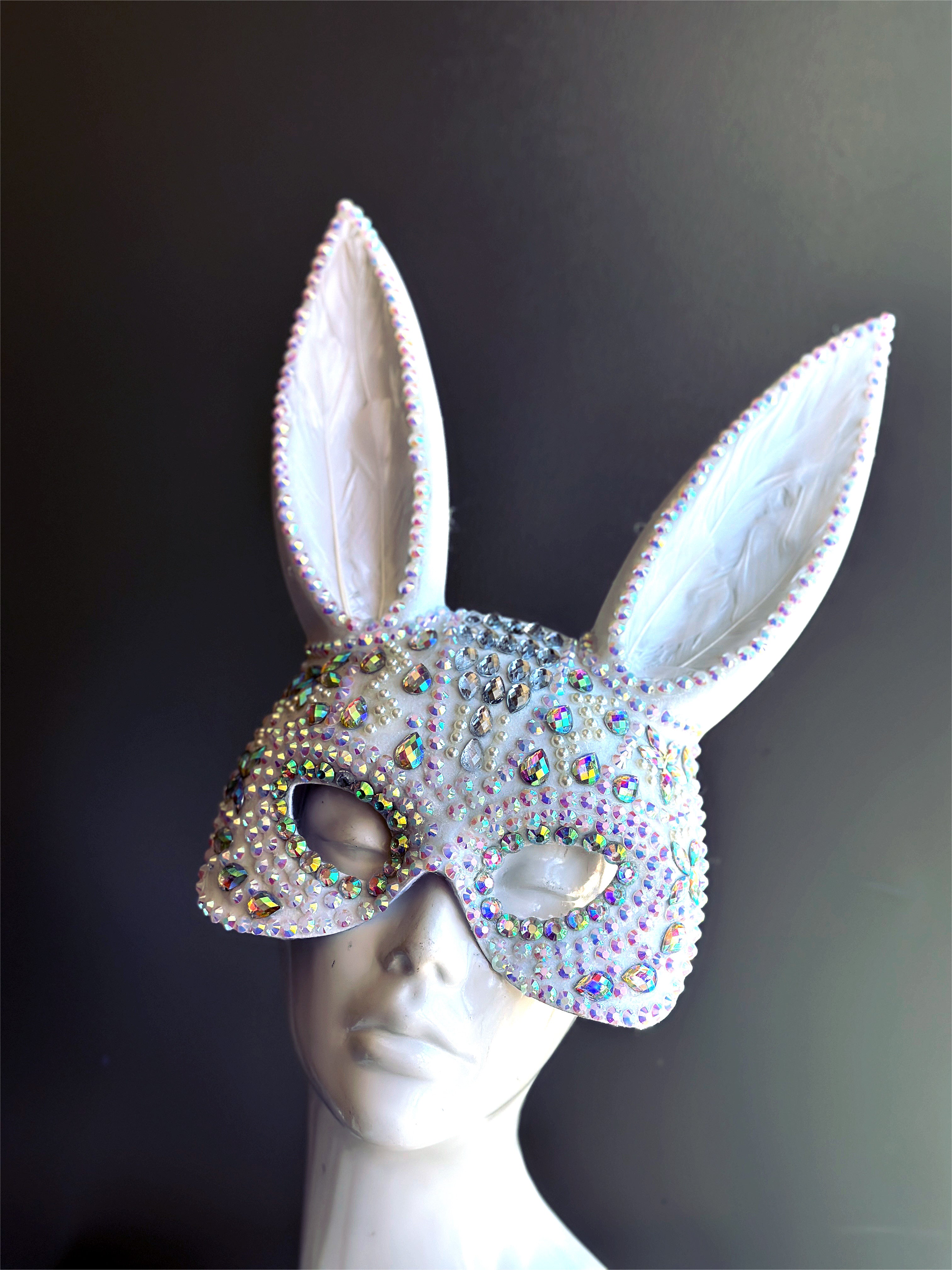 Sparkly white bunny ear masquerade mask with rhinestones and holographic gems, ideal for parties, raves, and masquerade balls.