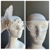 White masquerade couples mask set with lace feather pearl women’s mask and embossed swirl men’s mask.