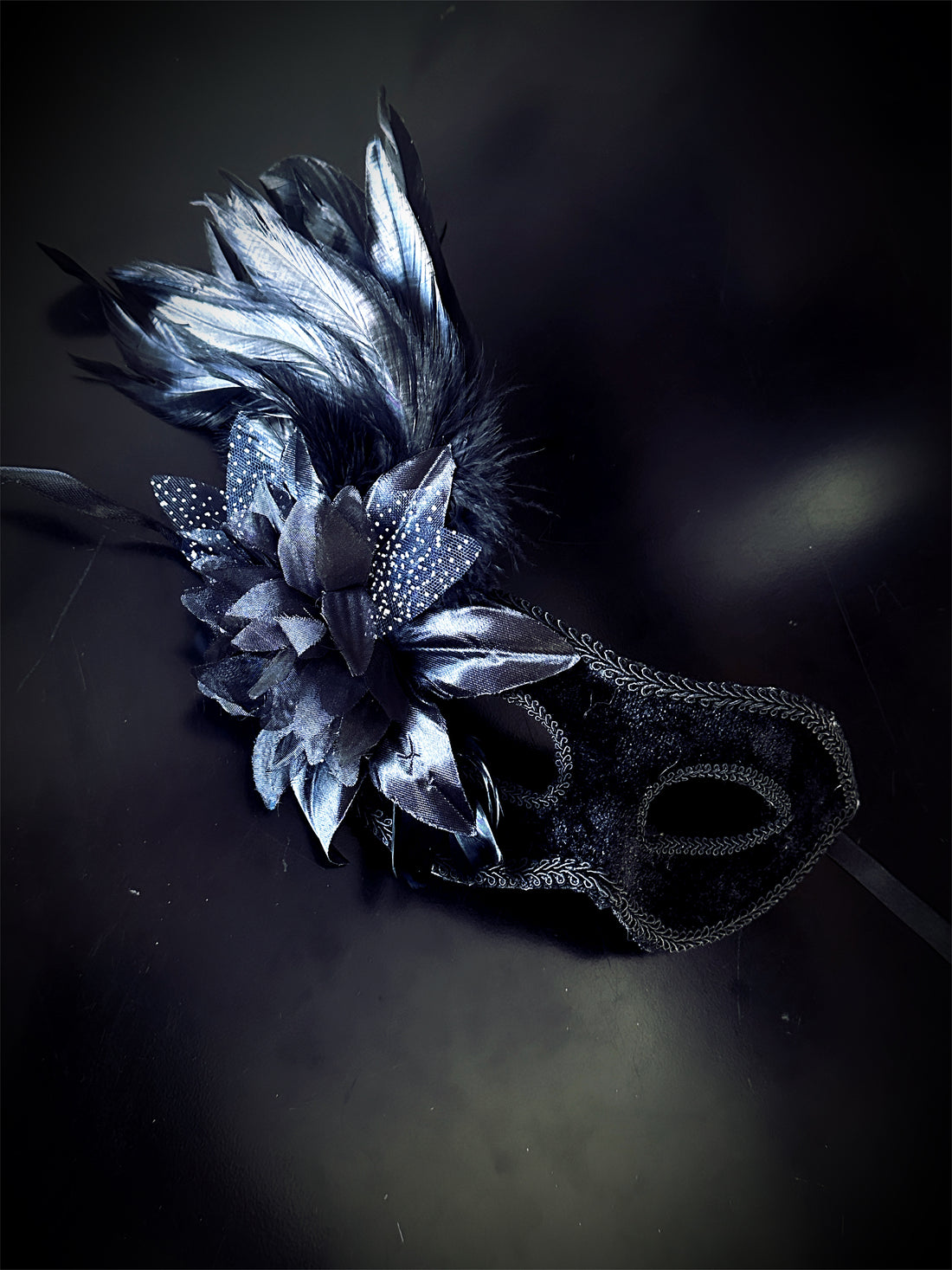 Womens masquerade mask in black velvet with feathers.