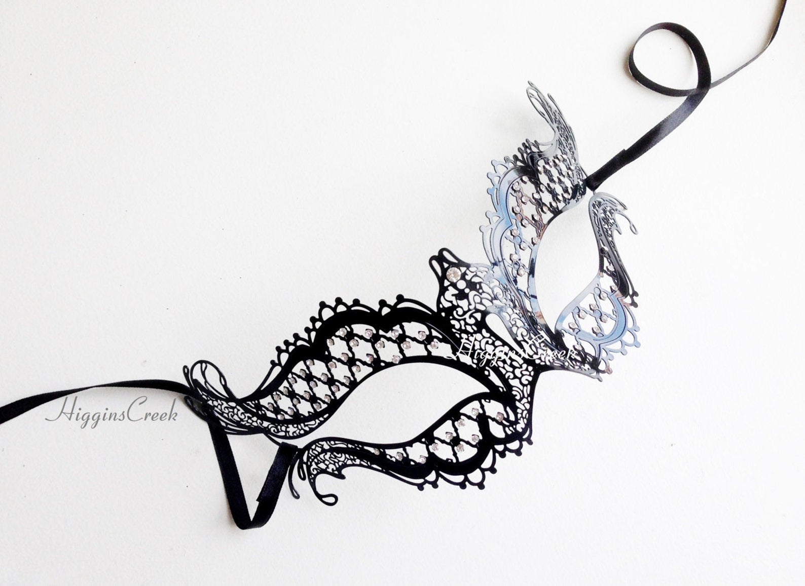 Womens metal masquerade mask in black with stones.