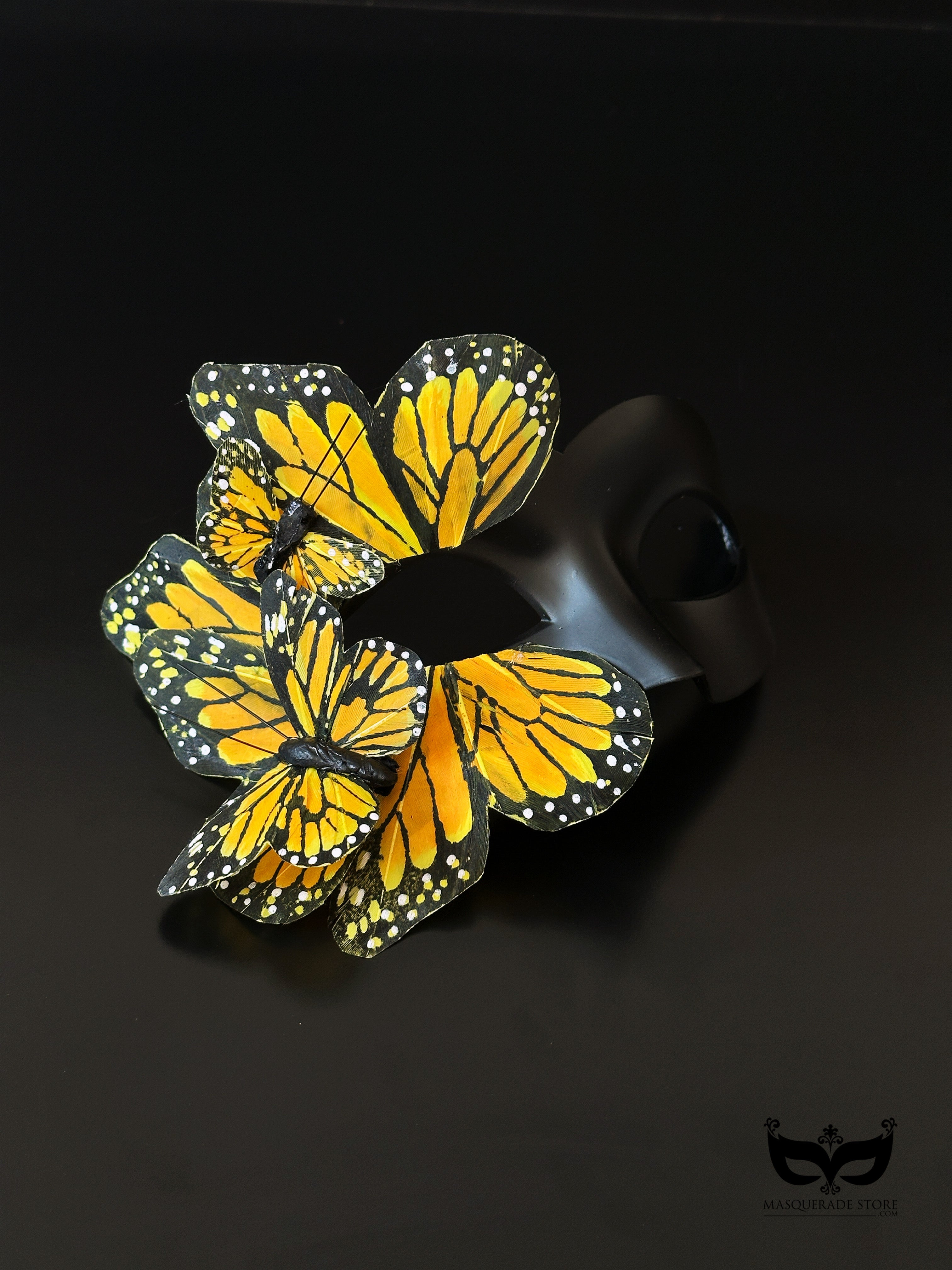 Yellow butterfly masquerade mask with layered wings for masquerade events.
